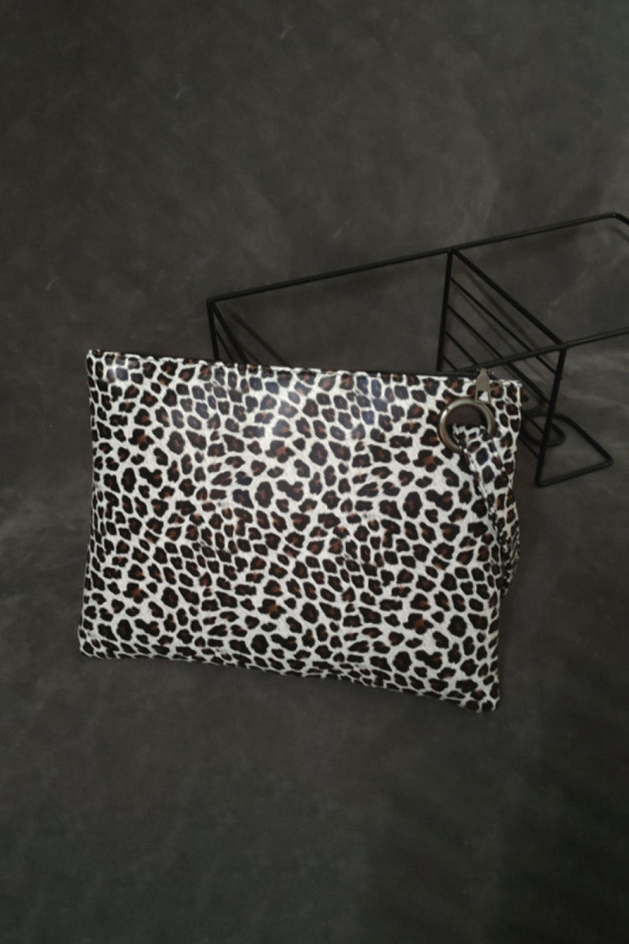 Leopard print clutch bag with zip top and ring detail