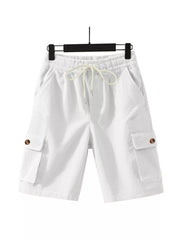White corduroy cargo shorts with drawstring waist and button-flap pockets.