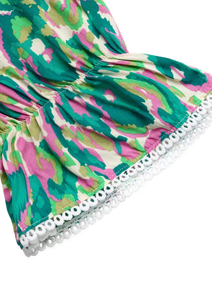 Maternity maxi dress with abstract print, V-neck, flounce sleeves, and white trim detail.