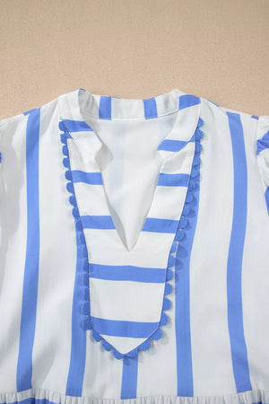 Tiered dress with blue and white stripes, V-neck, and ricrac trim.