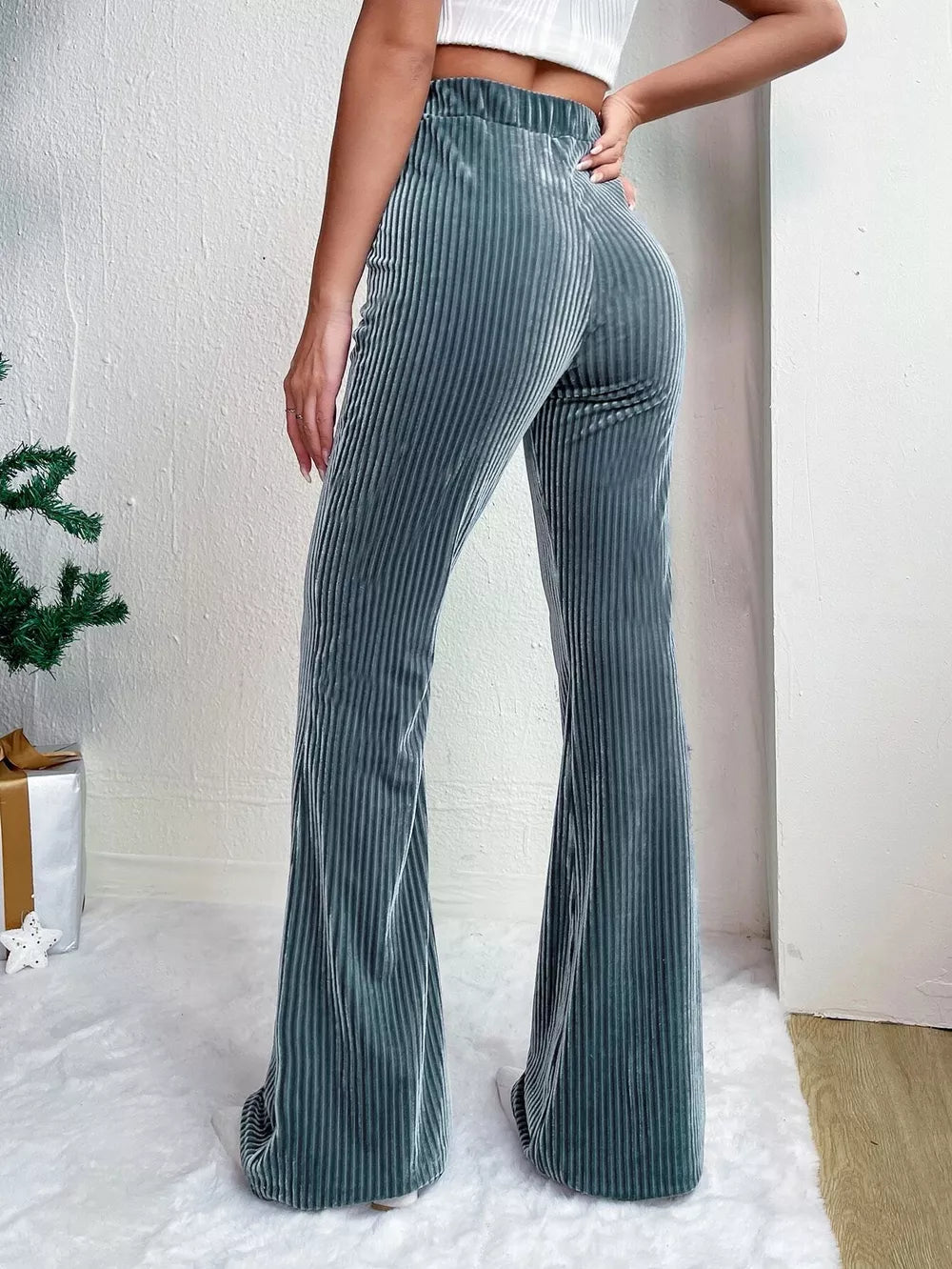 Peacock Blue corduroy high-waist flare maternity pants with bell bottoms.