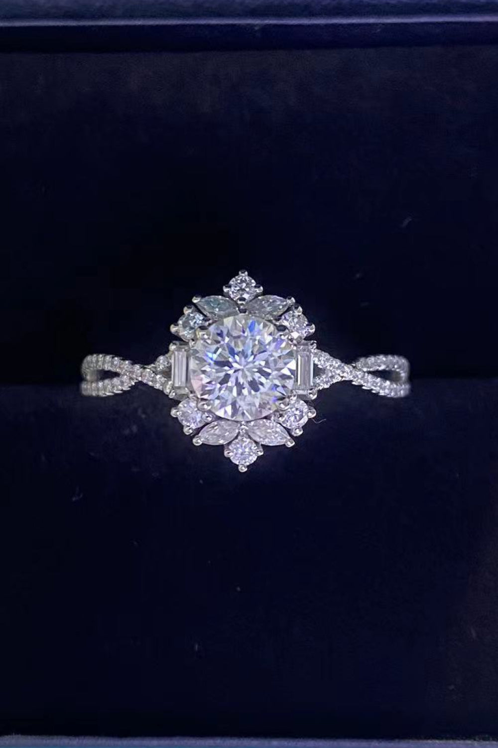 Silver halo twist ring with floral-inspired diamond accents