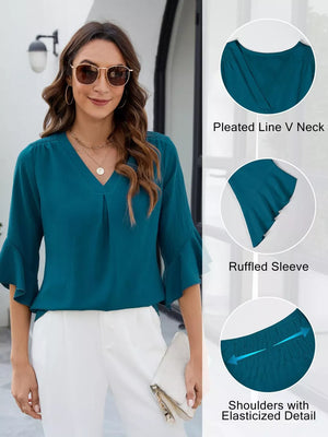 Teal V-neck blouse with ruffled sleeves and elasticized shoulders.
