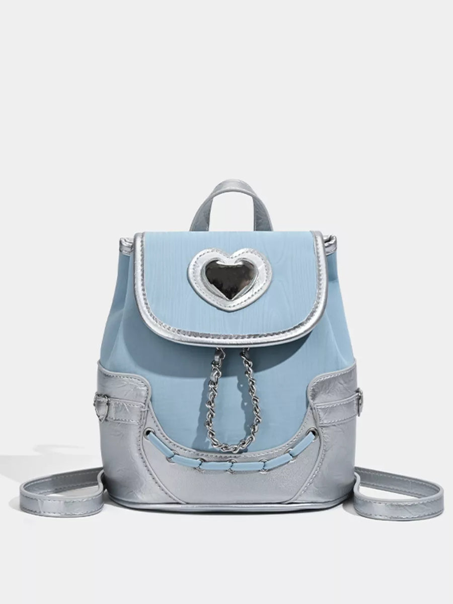 Charming blue mini backpack with silver heart flap and chain detail.