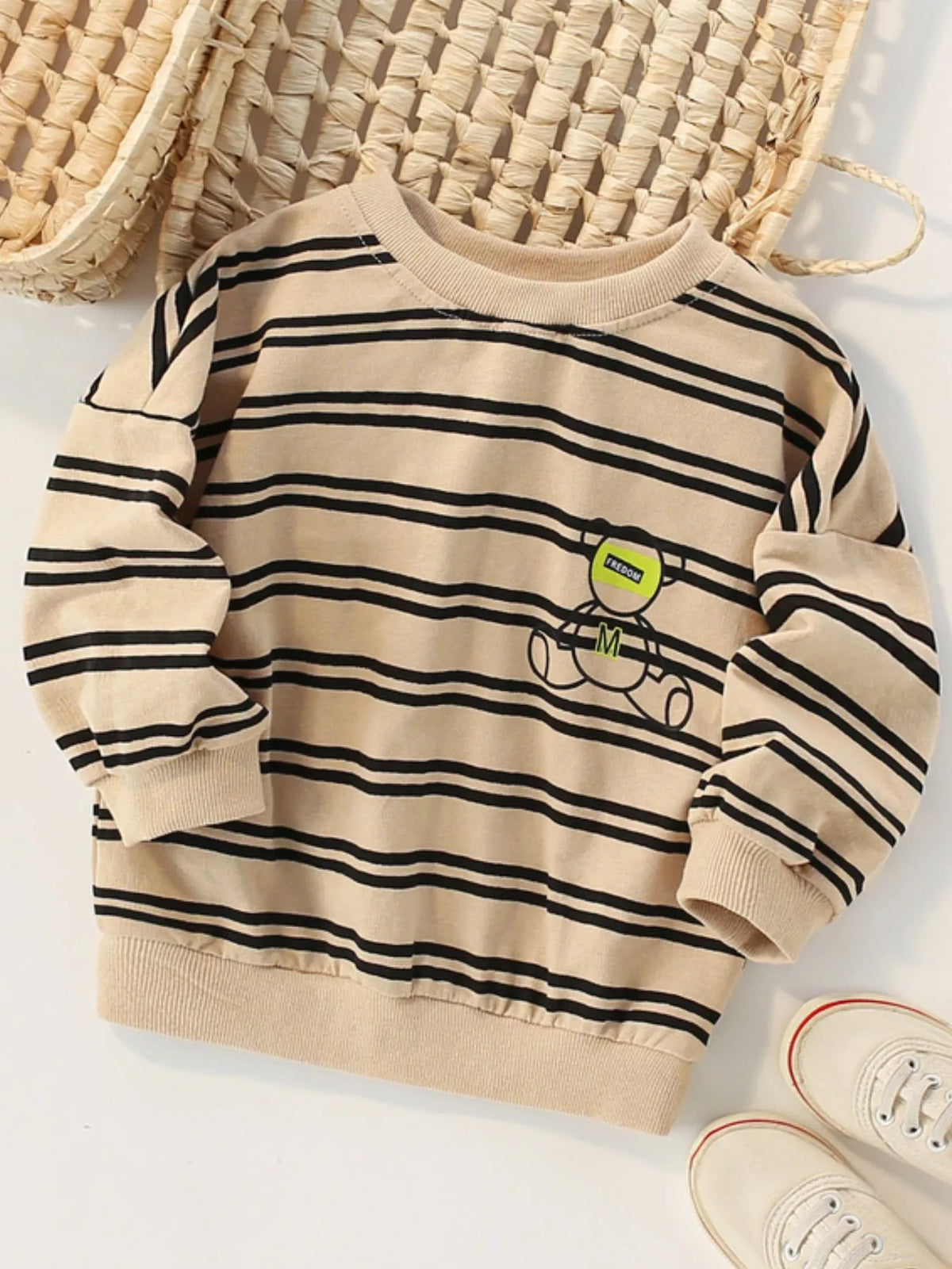 Tan striped crew neck sweatshirt with a bear graphic.
