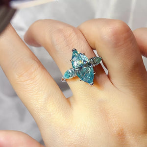 925 sterling silver,Moissanite Carat weight: 6ct Care instructions: Avoid wearin ring in Teal with regular silhouette
