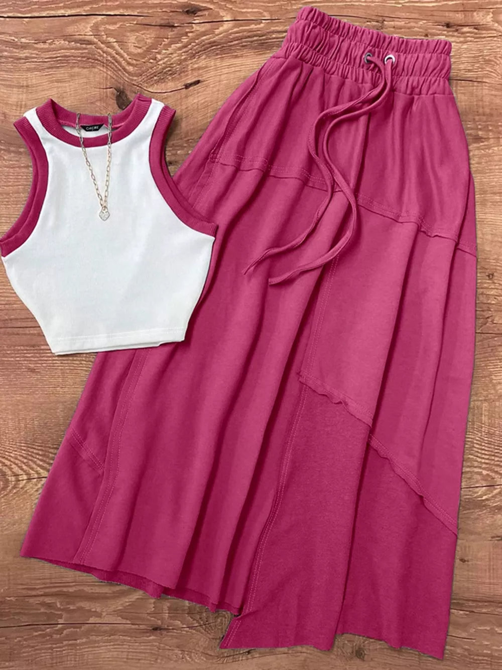 Chic contrast trim tank and maxi skirt set in pink polyester with adjustable drawstring waist.