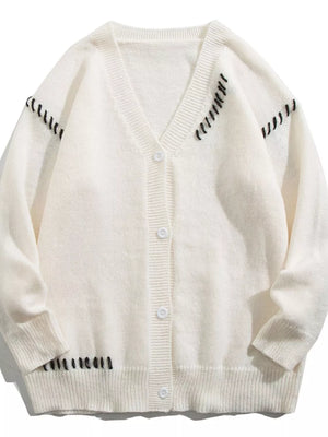 White ribbed V-neck cardigan with black stitching details and button front.