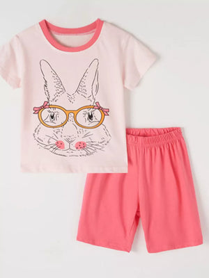 Pink cotton short sleeve pajamas with graphic bunny face and pink shorts.