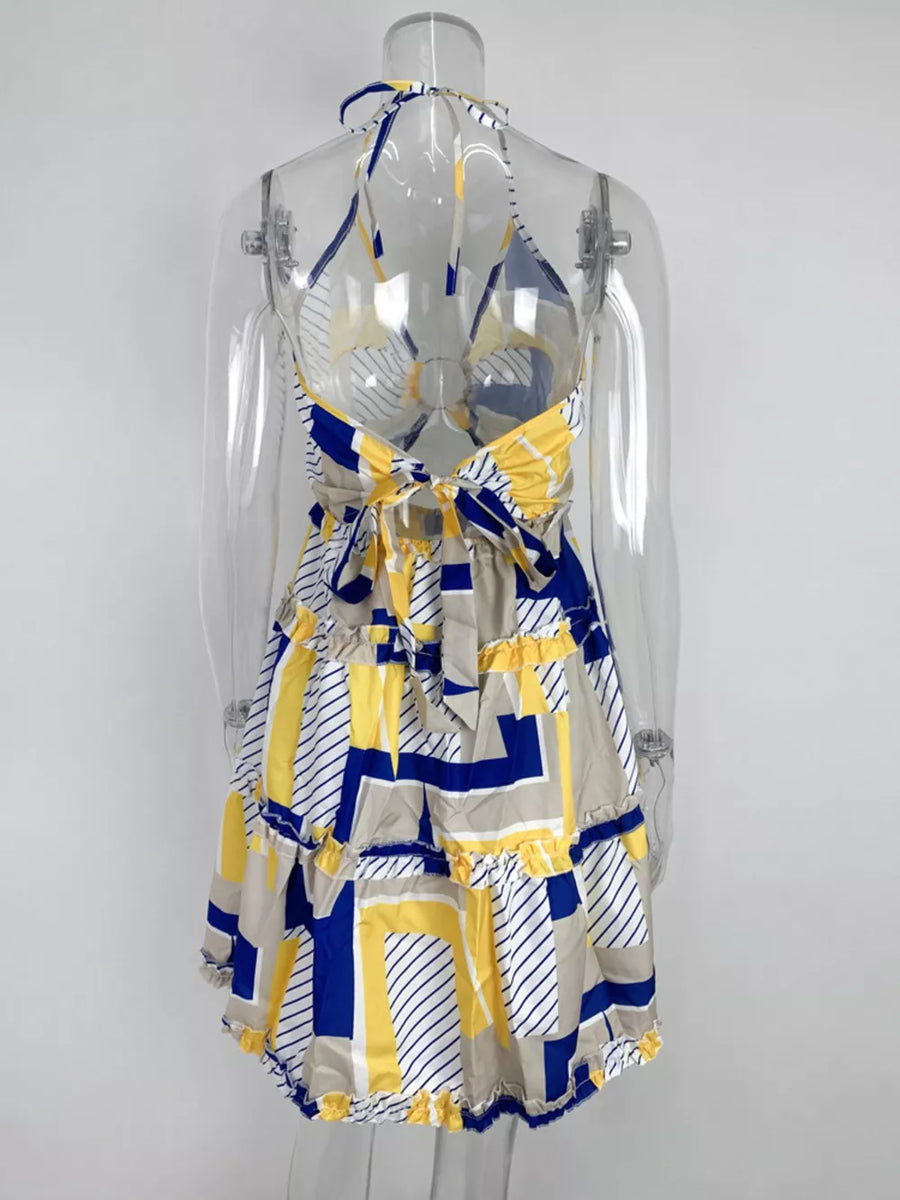 Abstract print halter mini dress with tiered ruffles and a tie back in yellow, blue, and tan.