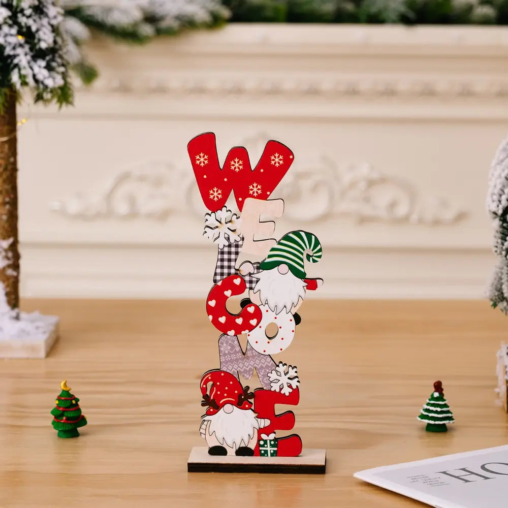 Wooden holiday word block set with gnomes and snowflakes, spelling WELCOME.