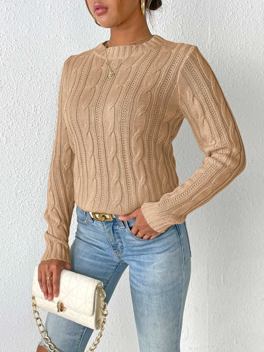 Camel cable knit sweater with mock neck and long sleeves.