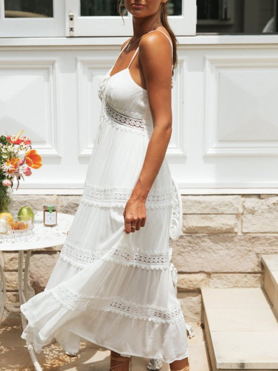 White lace trimmed tiered midi dress with spaghetti straps and empire waist.
