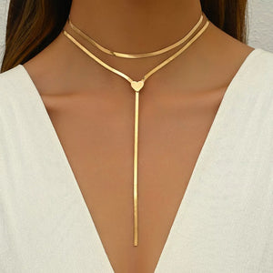 necklace in gold featuring layered and lariat fit