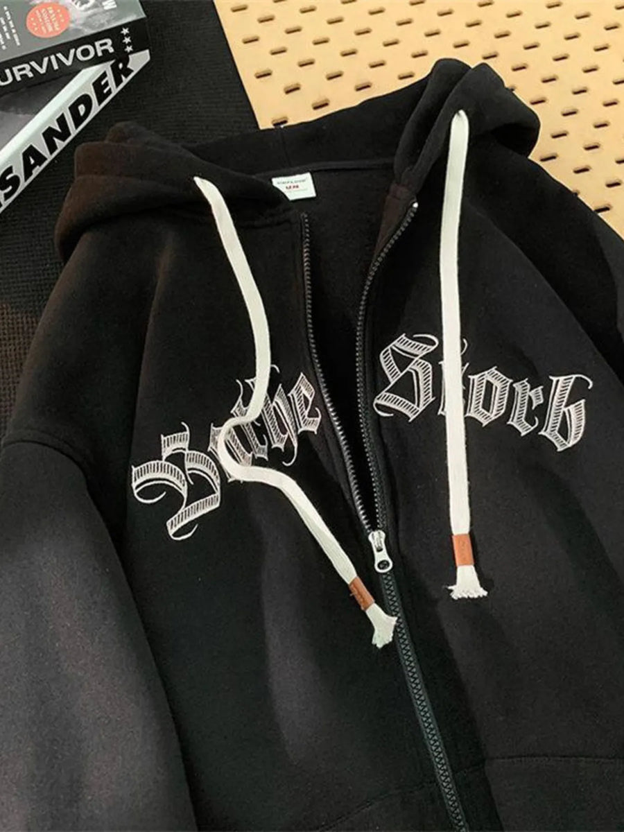 Black zip up hoodie with white drawstring and gothic text graphic