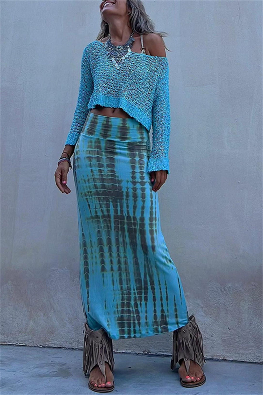 Cerulean asymmetric crochet crop top with off-the-shoulder neckline and long sleeves.