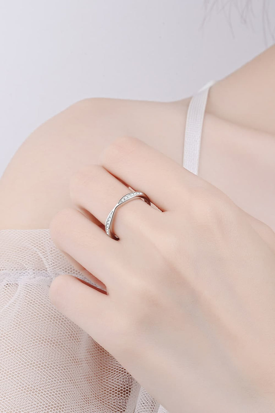 Silver twisted pavé band ring with clear stones