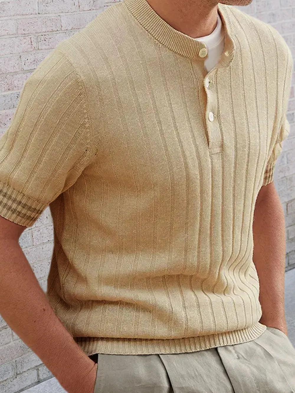 Textured ribbed henley polo shirt in khaki with short sleeves and button placket.