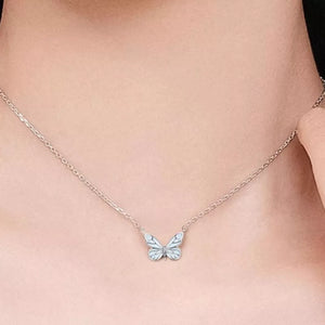 light blue necklace featuring butterfly pendant and motif