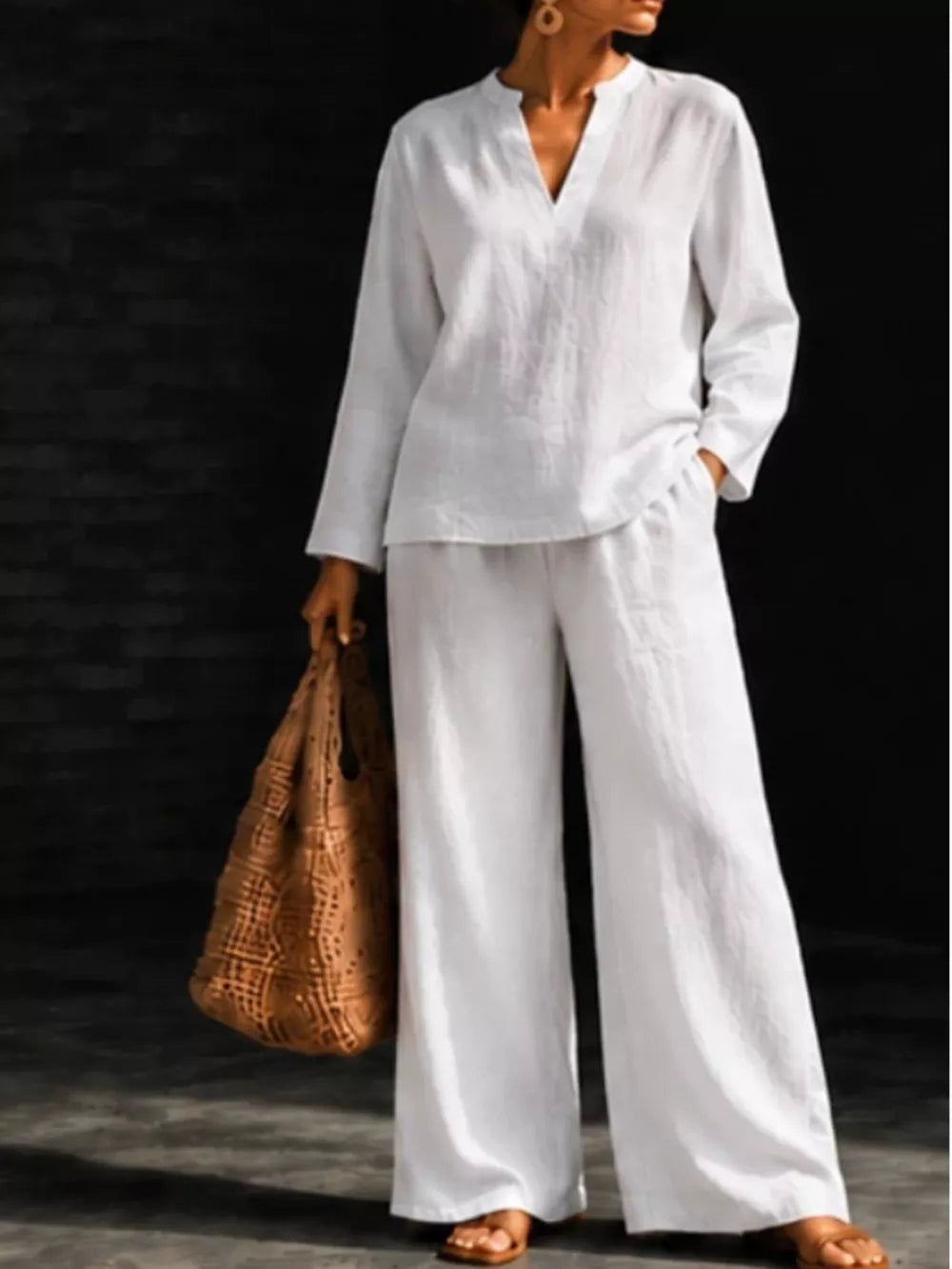 blouse in white featuring notched and relaxed fit