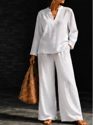 blouse in white featuring notched and relaxed fit