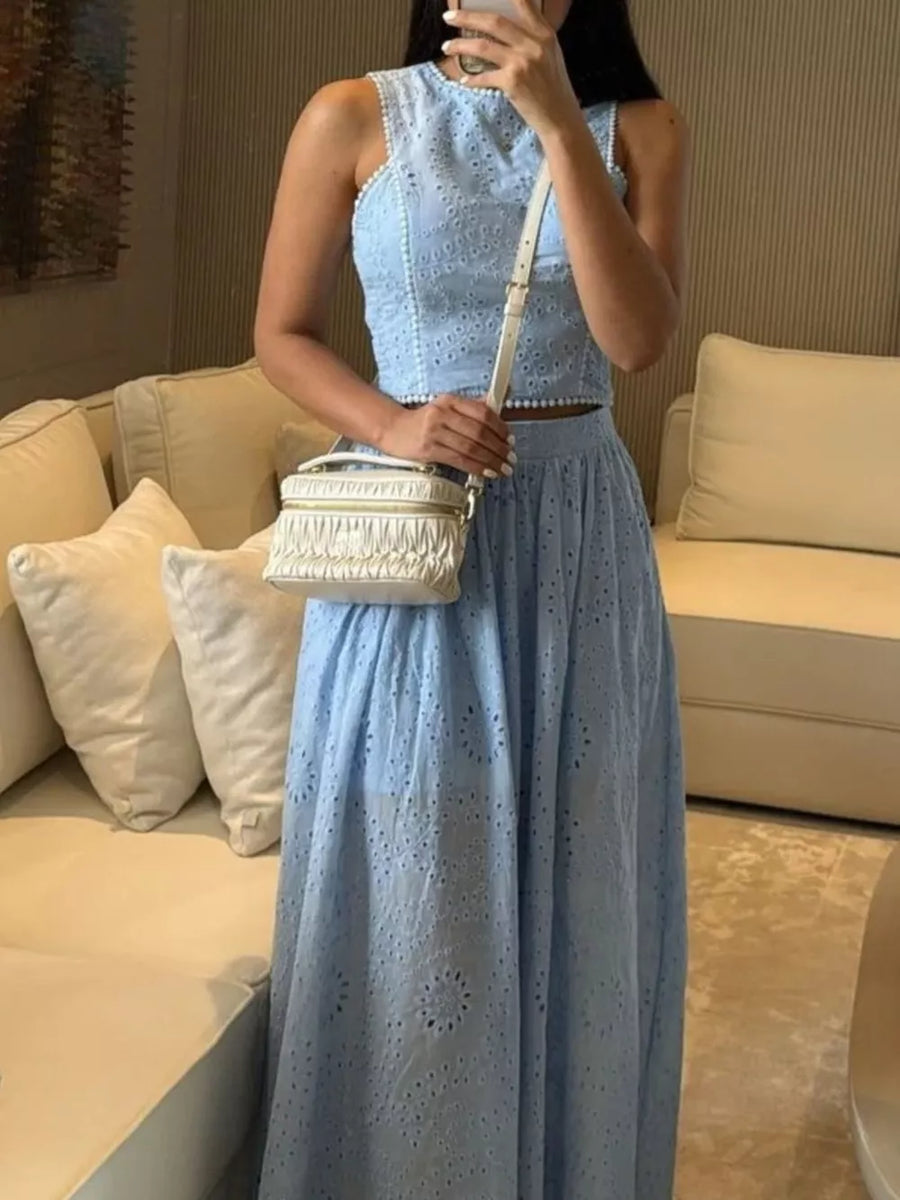 Light blue eyelet cropped top and maxi skirt set with white beaded trim.