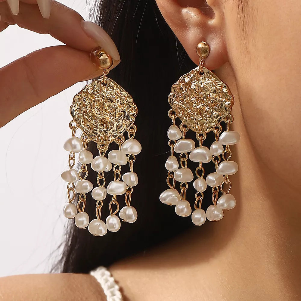 earrings in gold featuring dangle design and straight fit