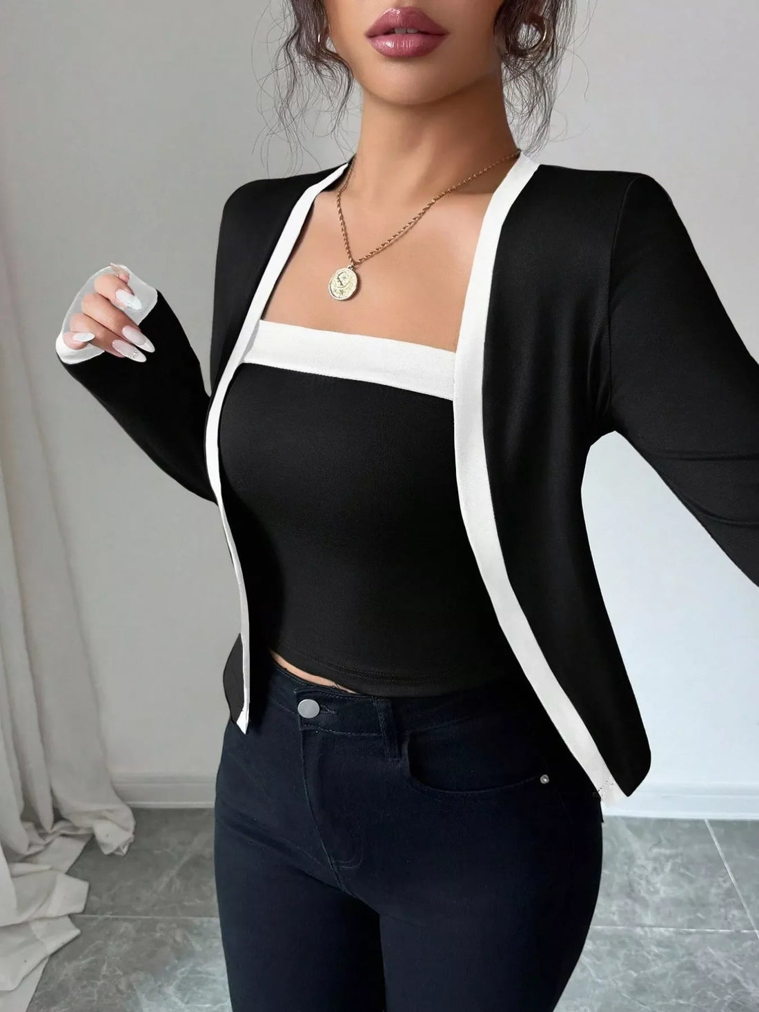 Black cardigan set with white trim and a square neck tank top