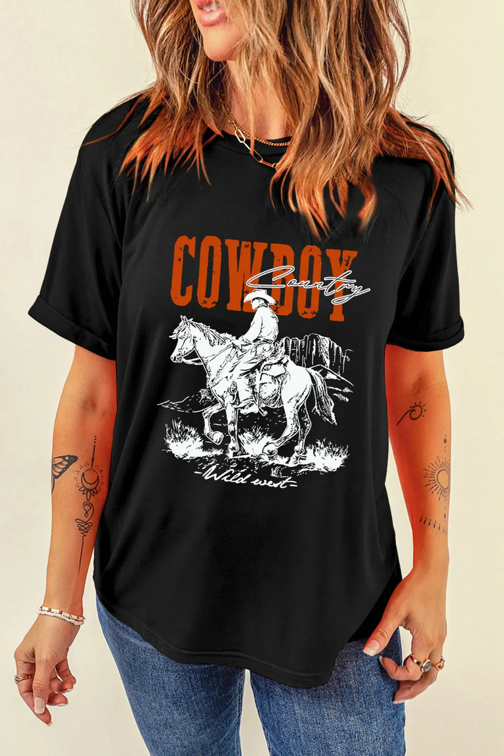 Black graphic tee with cowboy riding horse and "Cowboy Country" text