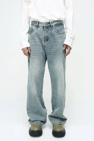 Baggy denim jeans in medium wash with subtle fade and relaxed fit.