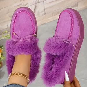 Purple suede loafers with shearling trim and bow detail