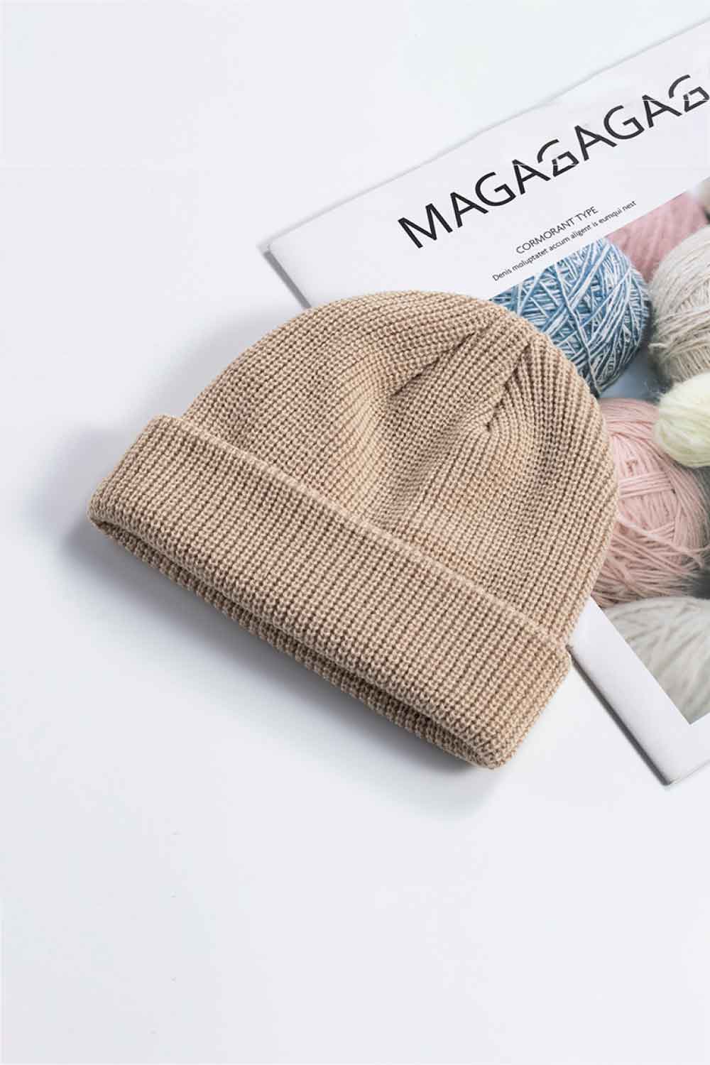 Tan ribbed knit beanie with a turned-up brim