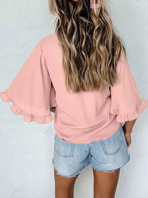Apricot ruffled mock neck half sleeve shirt with bell sleeves.