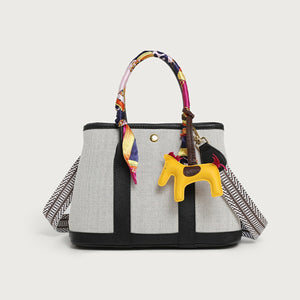 handbag in off-white featuring top handles and boxy fit
