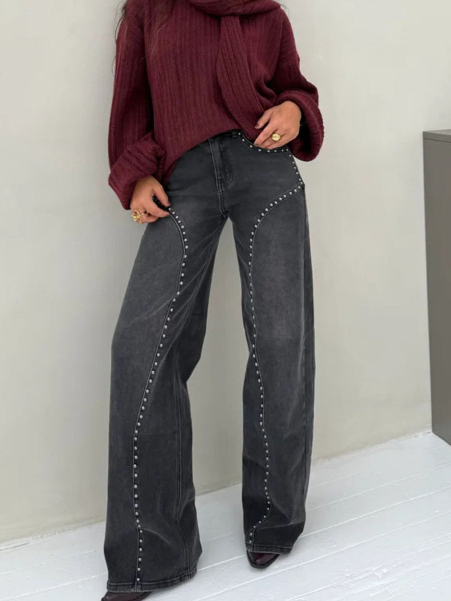 Dark gray studded high-waisted wide-leg jeans with button fly.