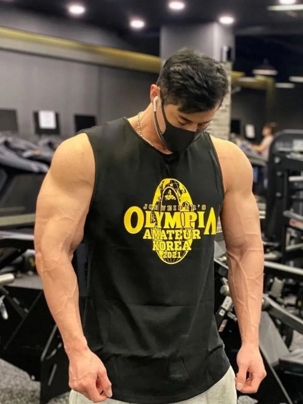 Black graphic muscle tank top with yellow Olympia Amateur Korea 2021 print