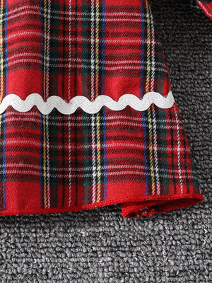 Baby girl's red plaid long-sleeve cotton dress with white scalloped trim detail.