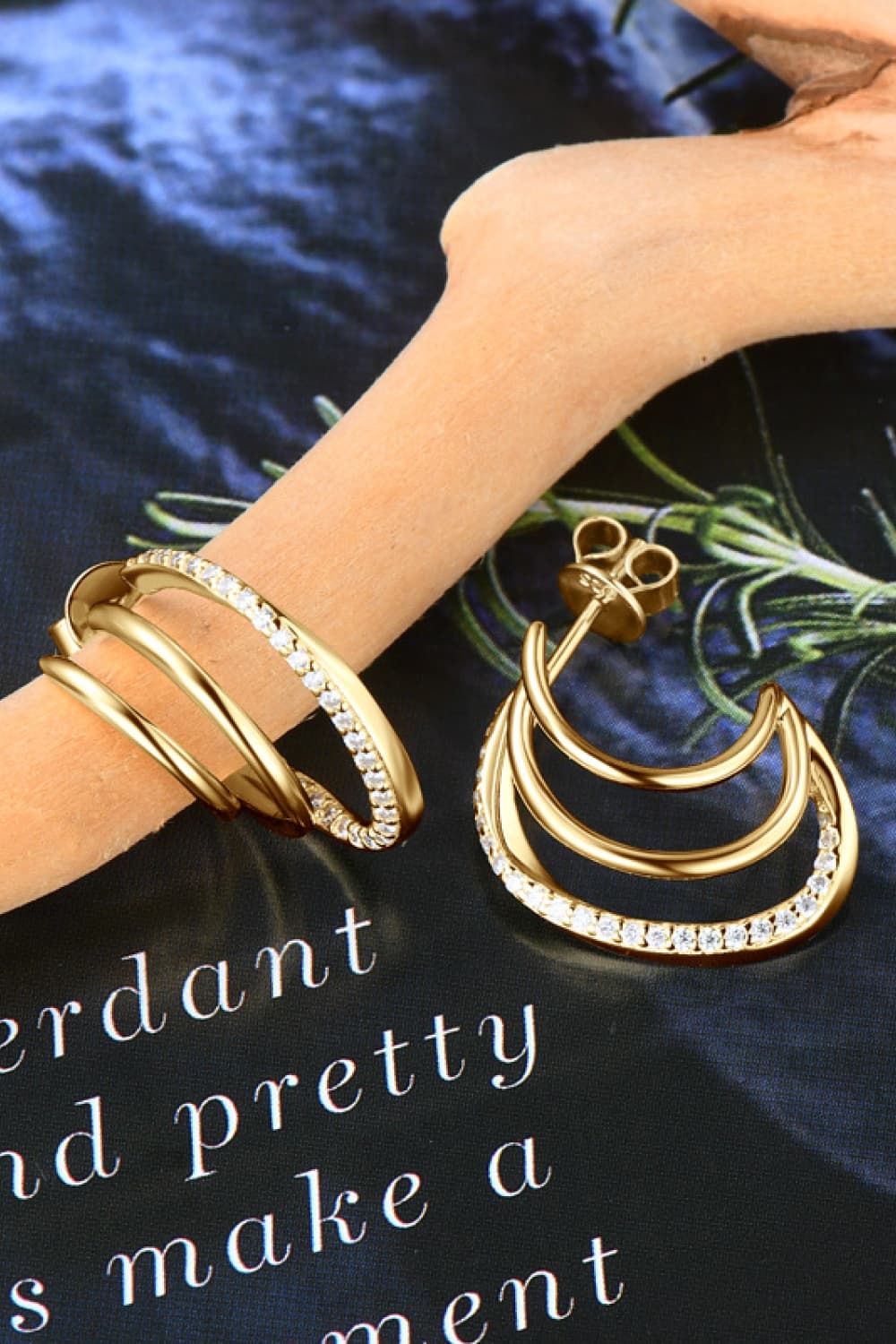 Gold triple hoop diamond stud earrings with pave-set stones