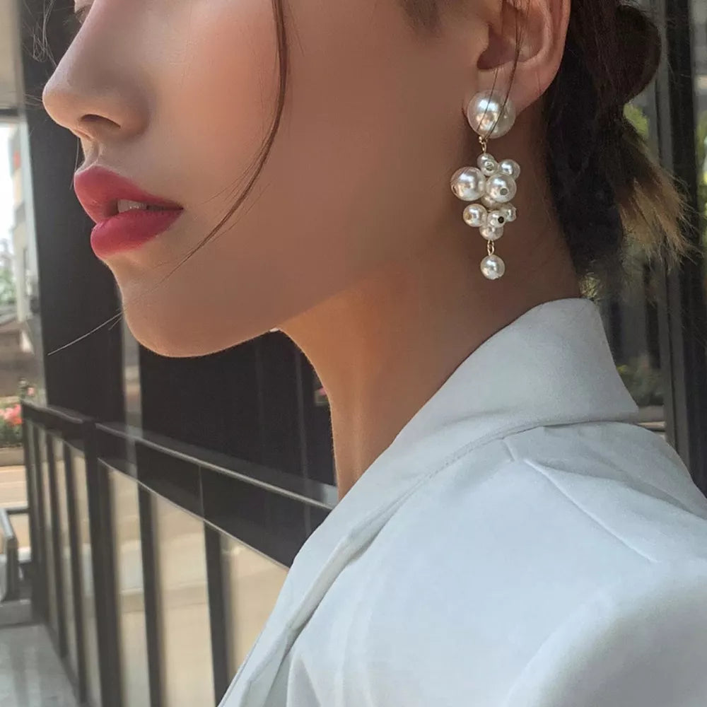 earrings in ivory featuring cluster design and dangle fit
