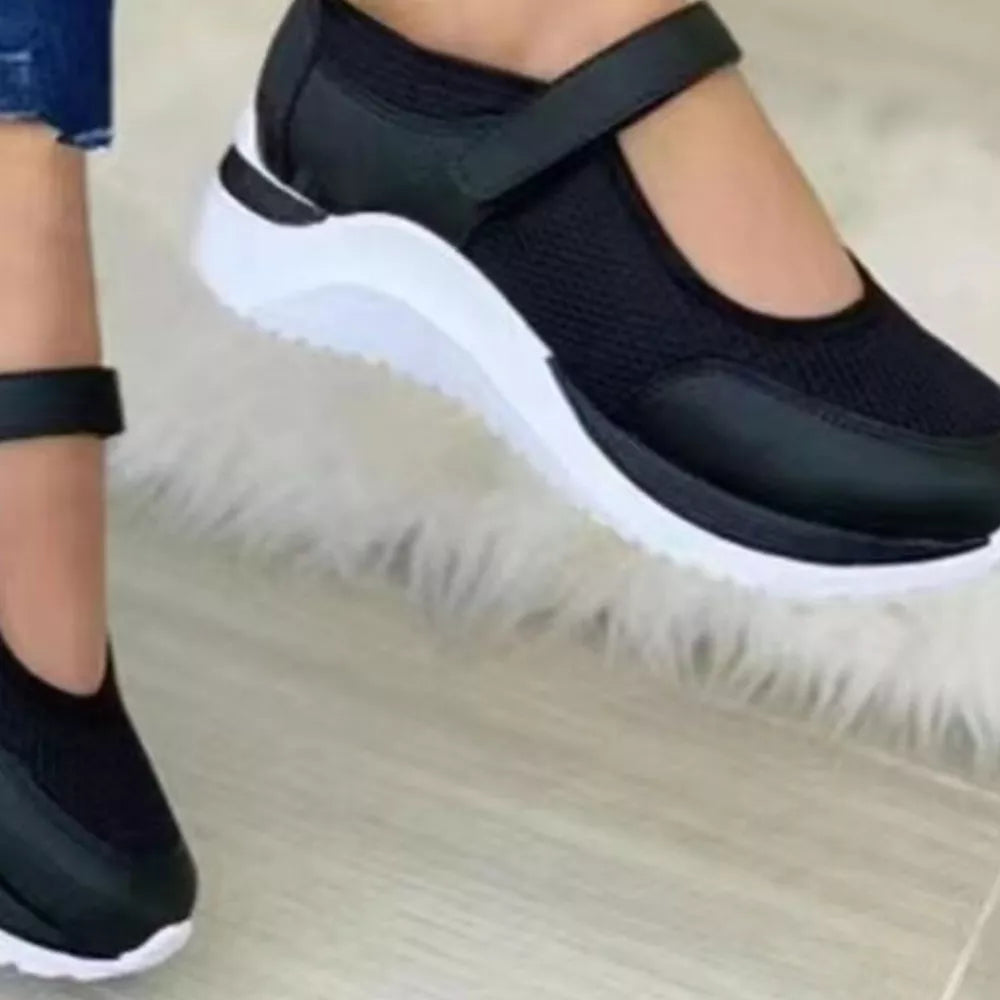 Black mesh Mary Jane flats with adjustable strap and chunky white sole