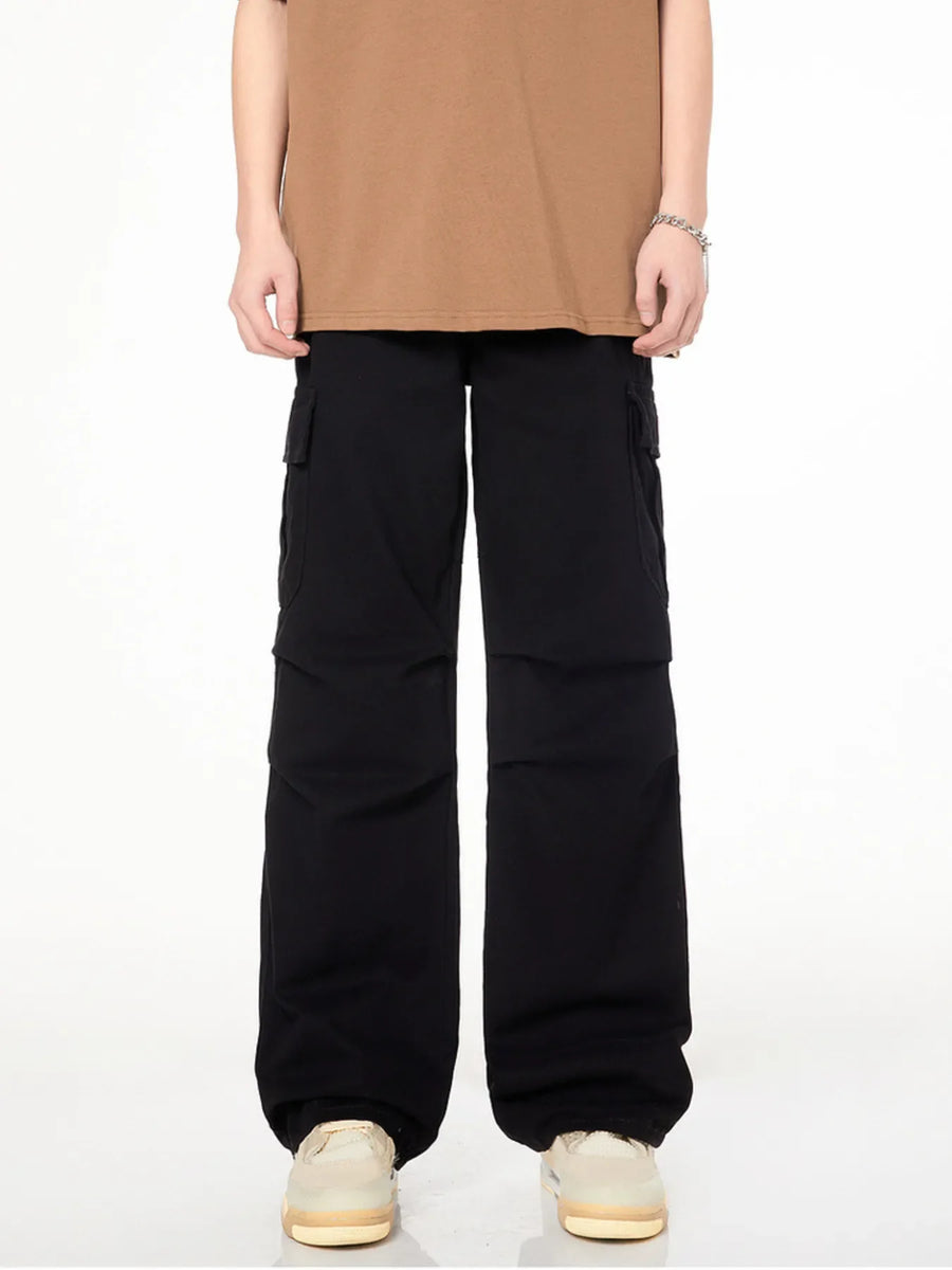 Men's black loose fit cargo pants with multiple pockets and a casual style.