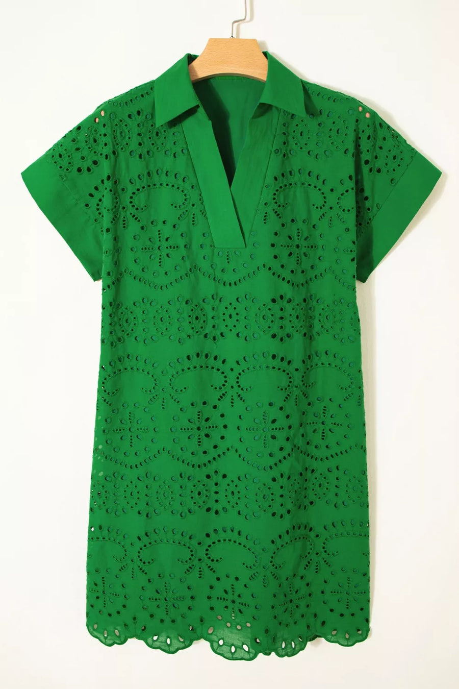 Green cotton eyelet collared dress with short sleeves and scalloped hem.