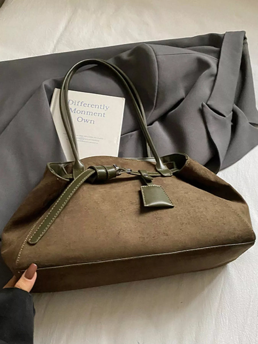 Brown suede shoulder bag with green trim and buckle detail