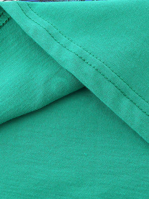 Green cotton t-shirt detail showing stitching and fabric texture.