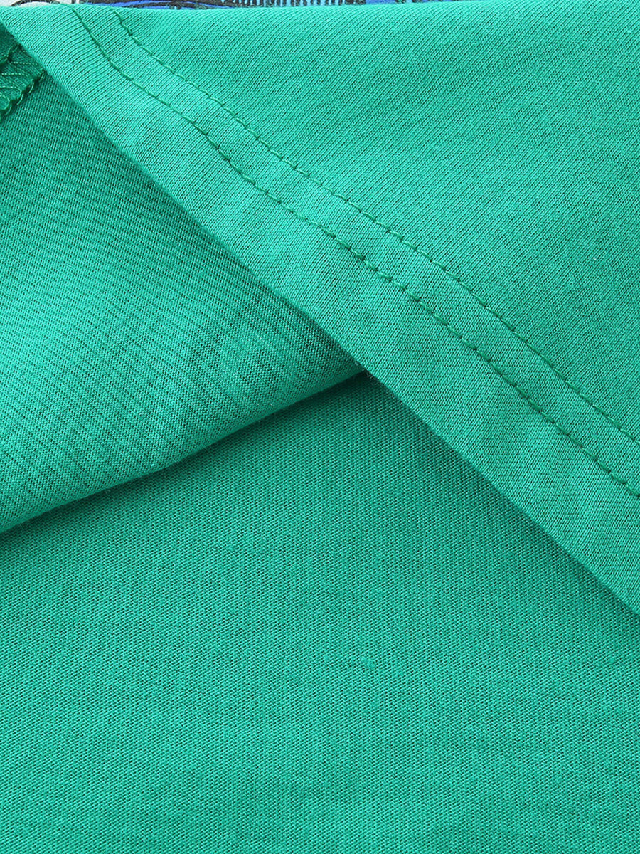 Green cotton t-shirt detail showing stitching and fabric texture.
