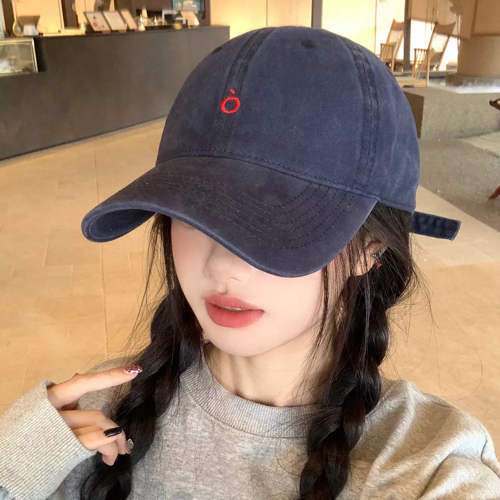 Indigo cotton baseball cap with curved brim and red embroidery detail