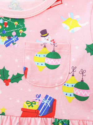 Pink cotton baby dress with Christmas print, featuring a snowman, ornaments, gifts, and tree.