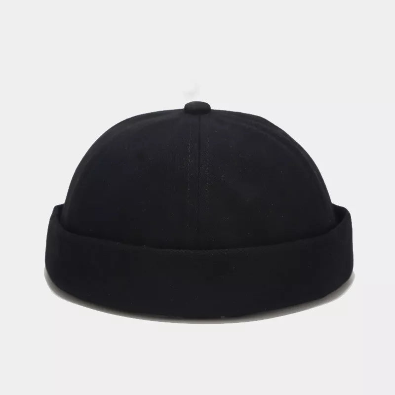 hat in black featuring brimless and fitted fit