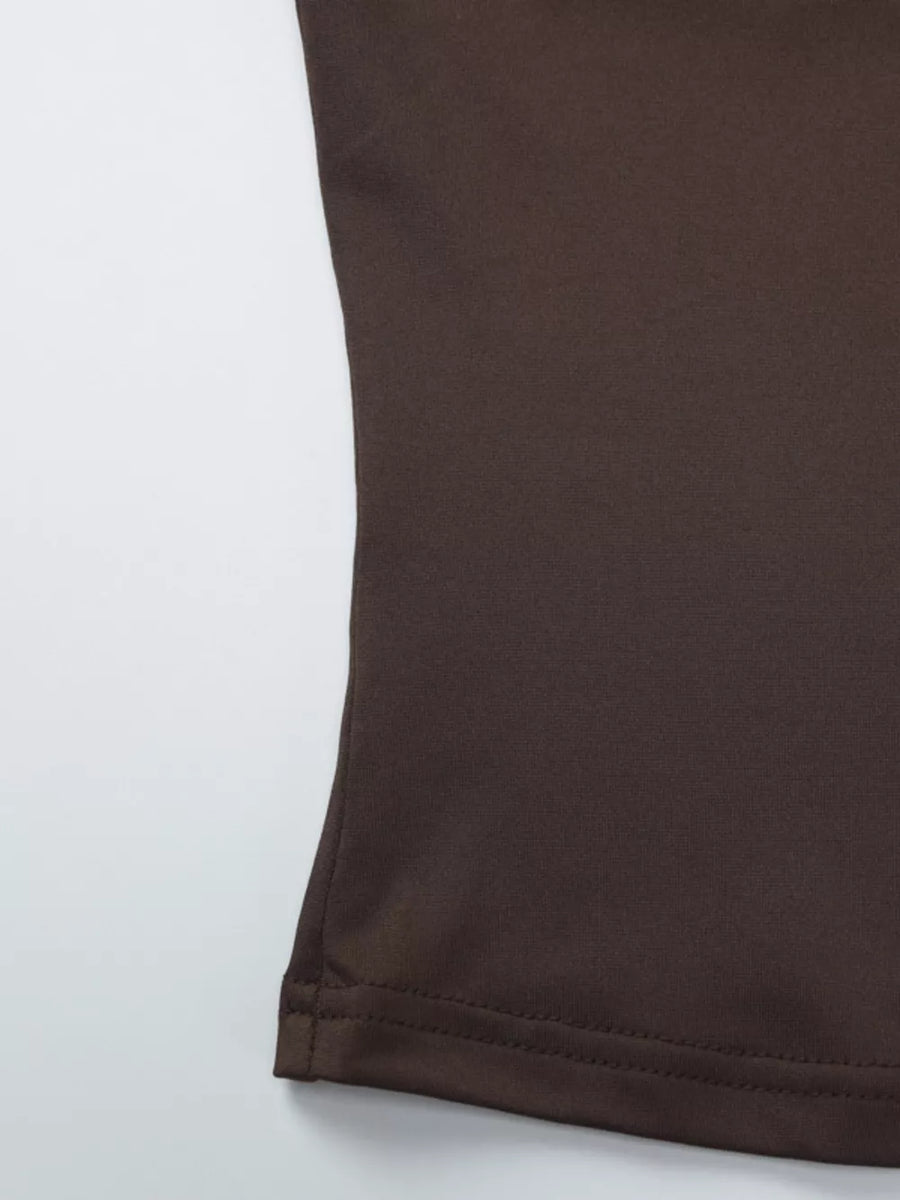 Brown halter crop top detail showing hem stitching