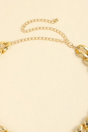 Chunky gold-tone curb chain necklace with extender chain and lobster clasp closure.